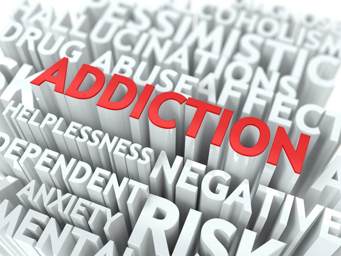addiction in red text among other words dependent negativity risk drug abuse in white text - addiction versus dependence - great oaks recovery center houston addiction treatment and texas drug rehab 
