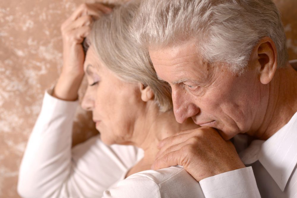 elderly couple consoling each other in an embrace - losing a child to addiction - great oaks recovery center - houston drug rehab - texas alcohol addiction treatment center
