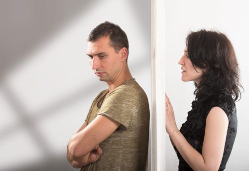 overcoming drug addiction - man and woman opposite sides of a door - great oaks recovery center
