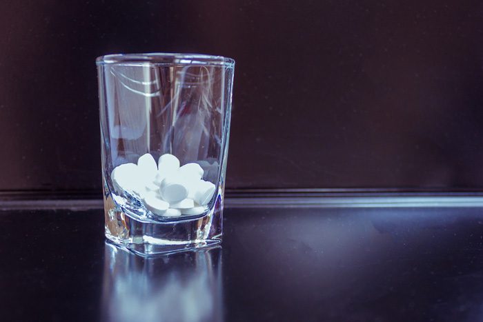 Common Medications Used for Alcohol Treatment and Rehab - pills in shot glass